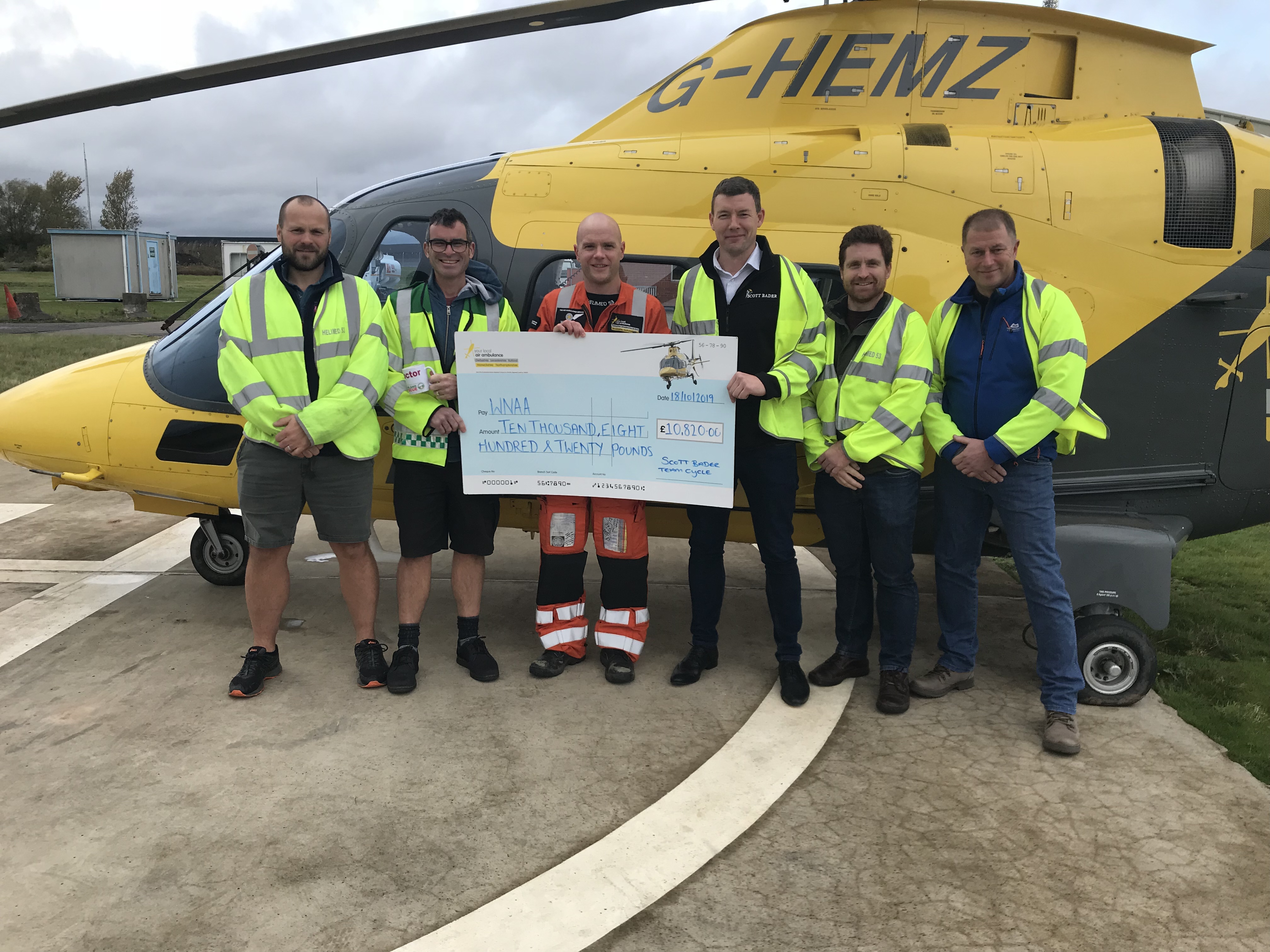 Scott Bader’s Lands’ End to John O’Groats cycle team presents over £10,000 to The Warwickshire & Northamptonshire Air Ambulance